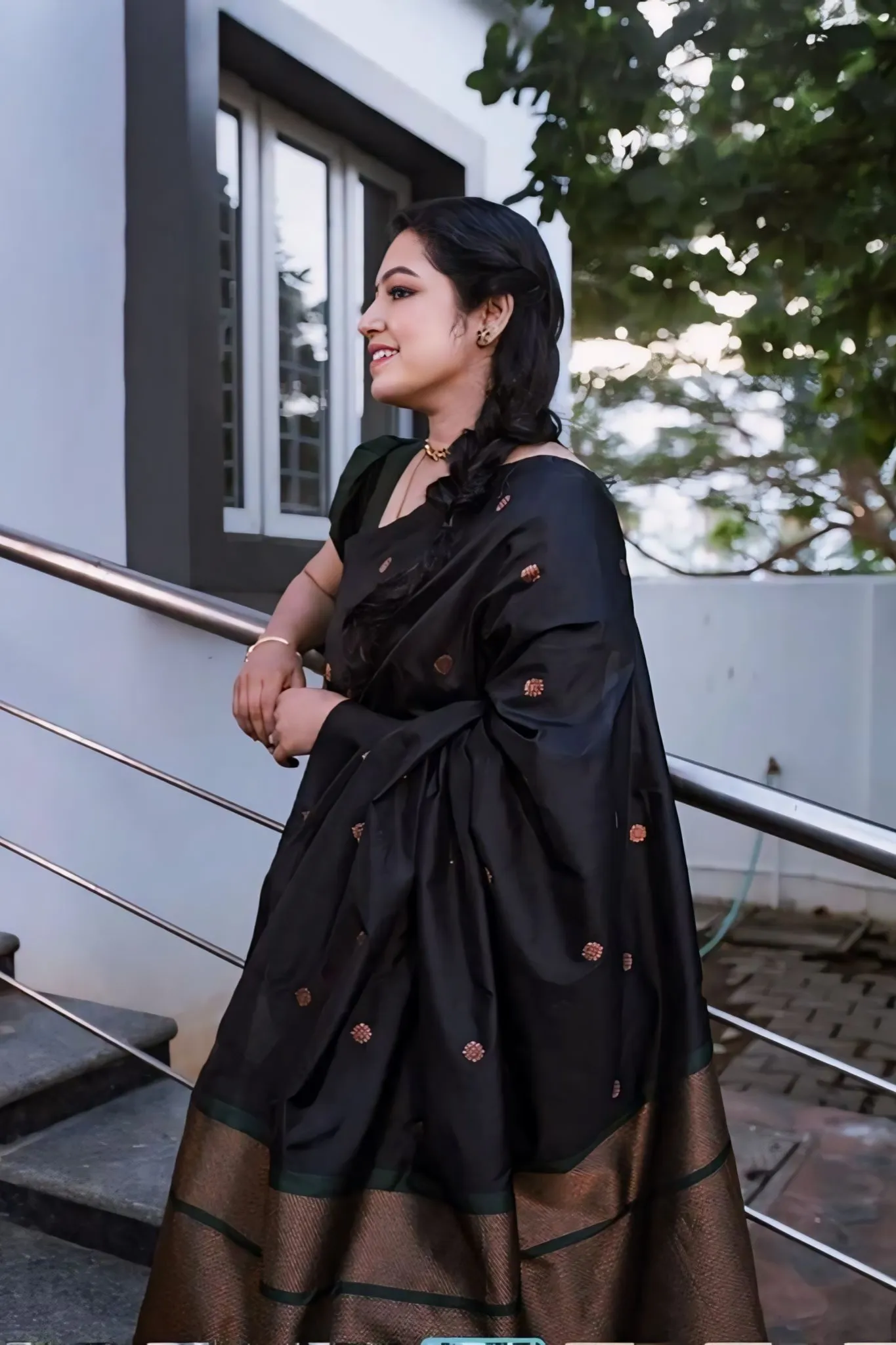 A FOREST SILK SAREE WITH SUBTLE ZARI BUTTAS AND RICH BORDER