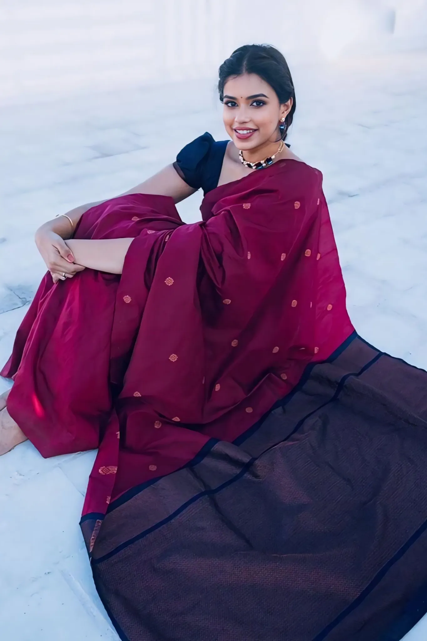 A FOREST SILK SAREE WITH SUBTLE ZARI BUTTAS AND RICH BORDER