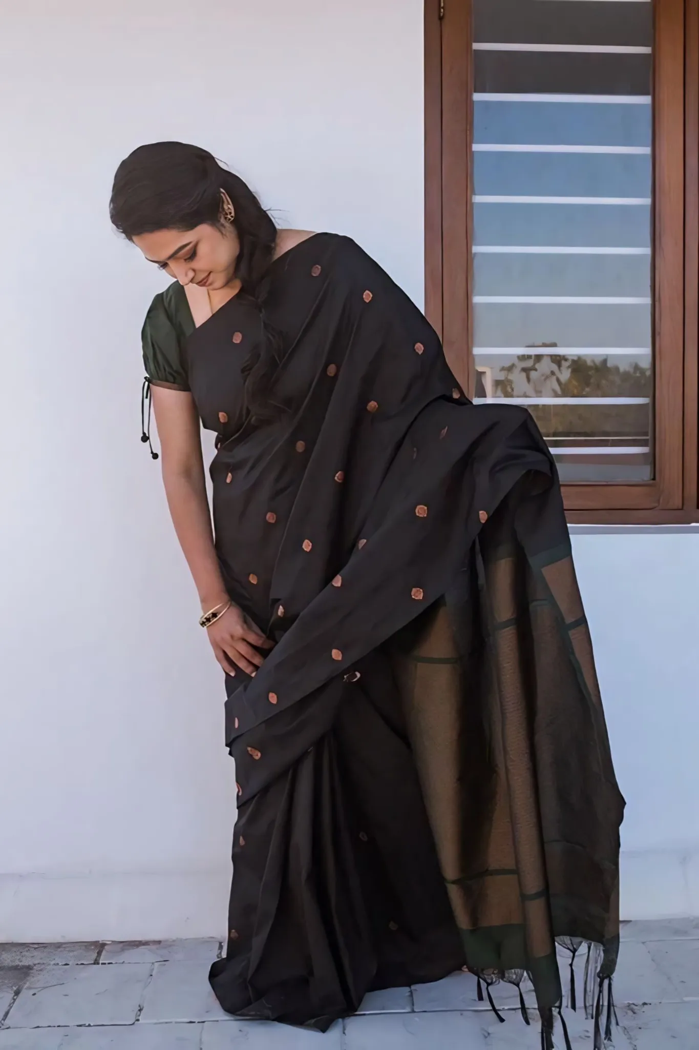 A FOREST SILK SAREE WITH SUBTLE ZARI BUTTAS AND RICH BORDER