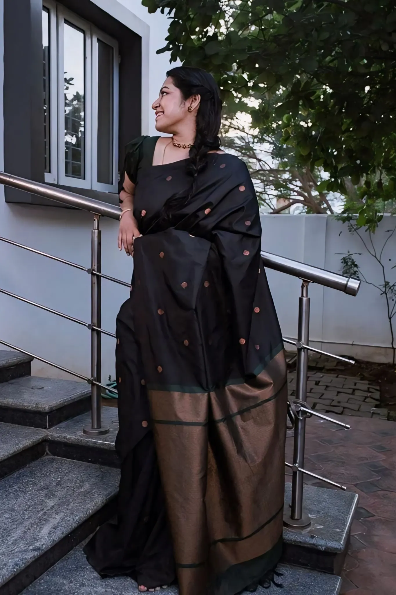 A FOREST SILK SAREE WITH SUBTLE ZARI BUTTAS AND RICH BORDER