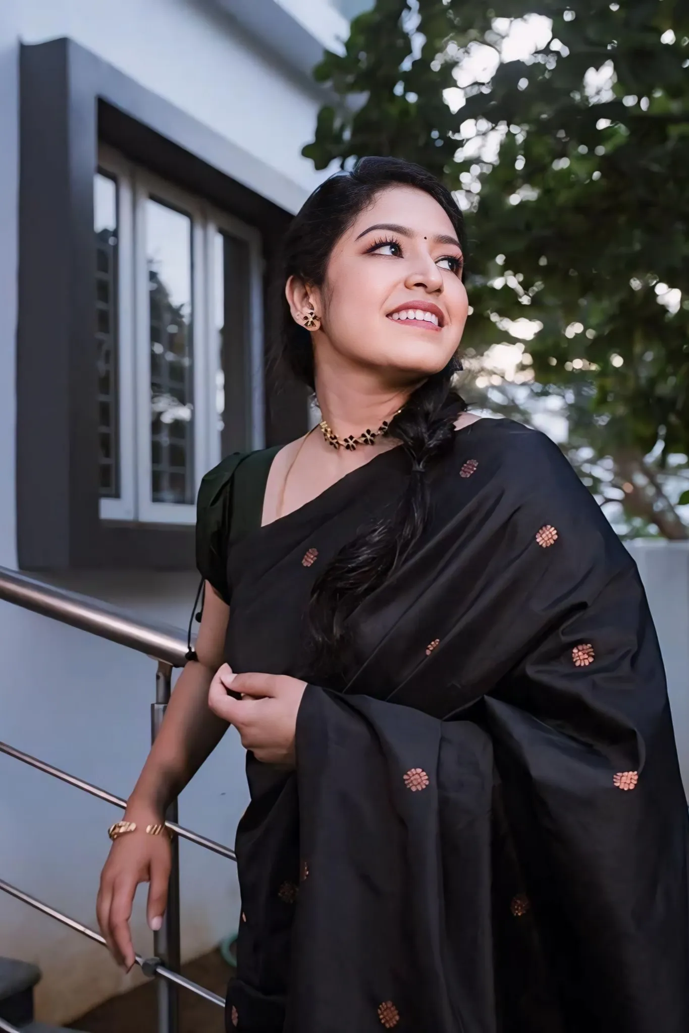 A FOREST SILK SAREE WITH SUBTLE ZARI BUTTAS AND RICH BORDER