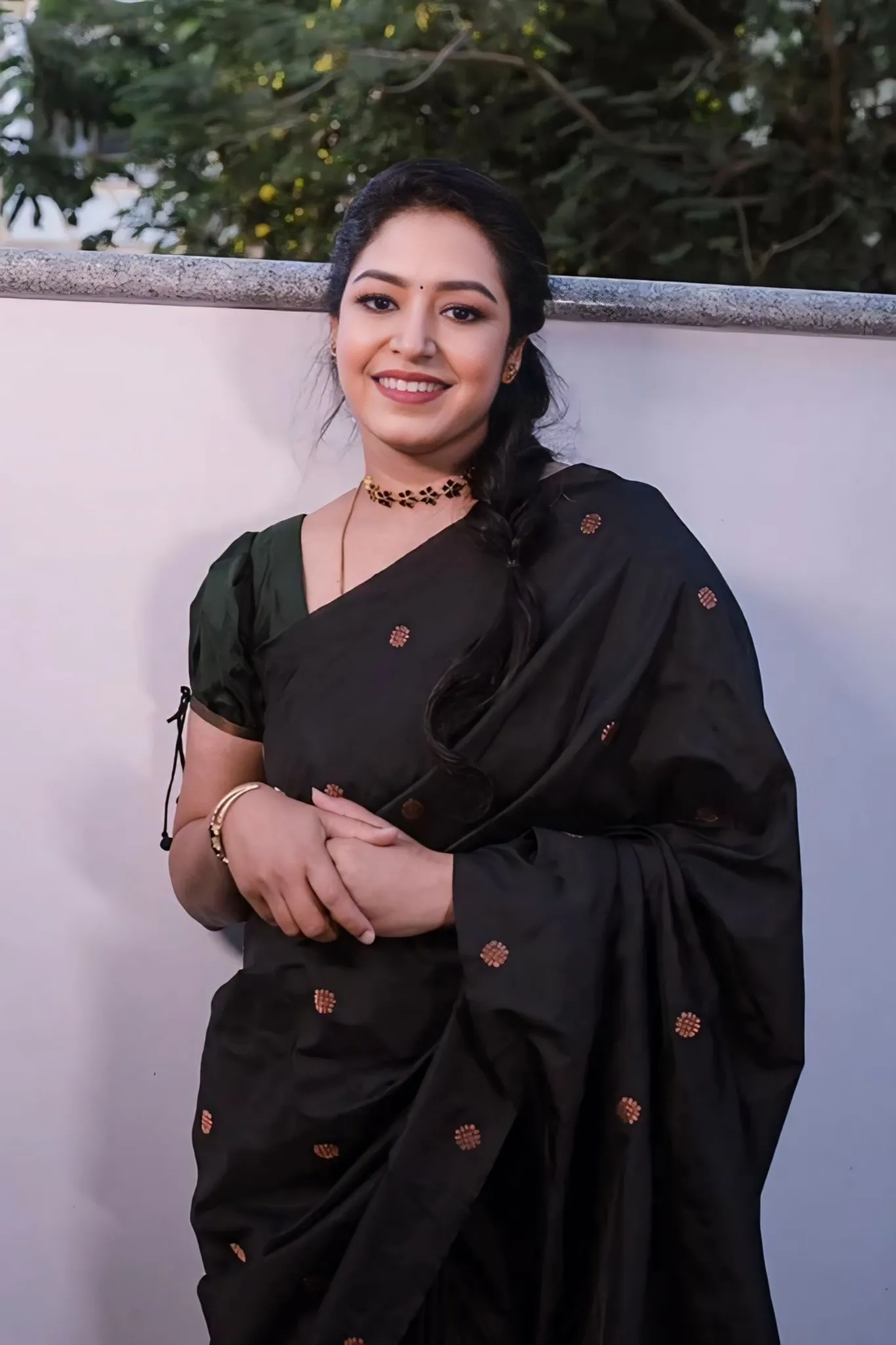 A FOREST SILK SAREE WITH SUBTLE ZARI BUTTAS AND RICH BORDER