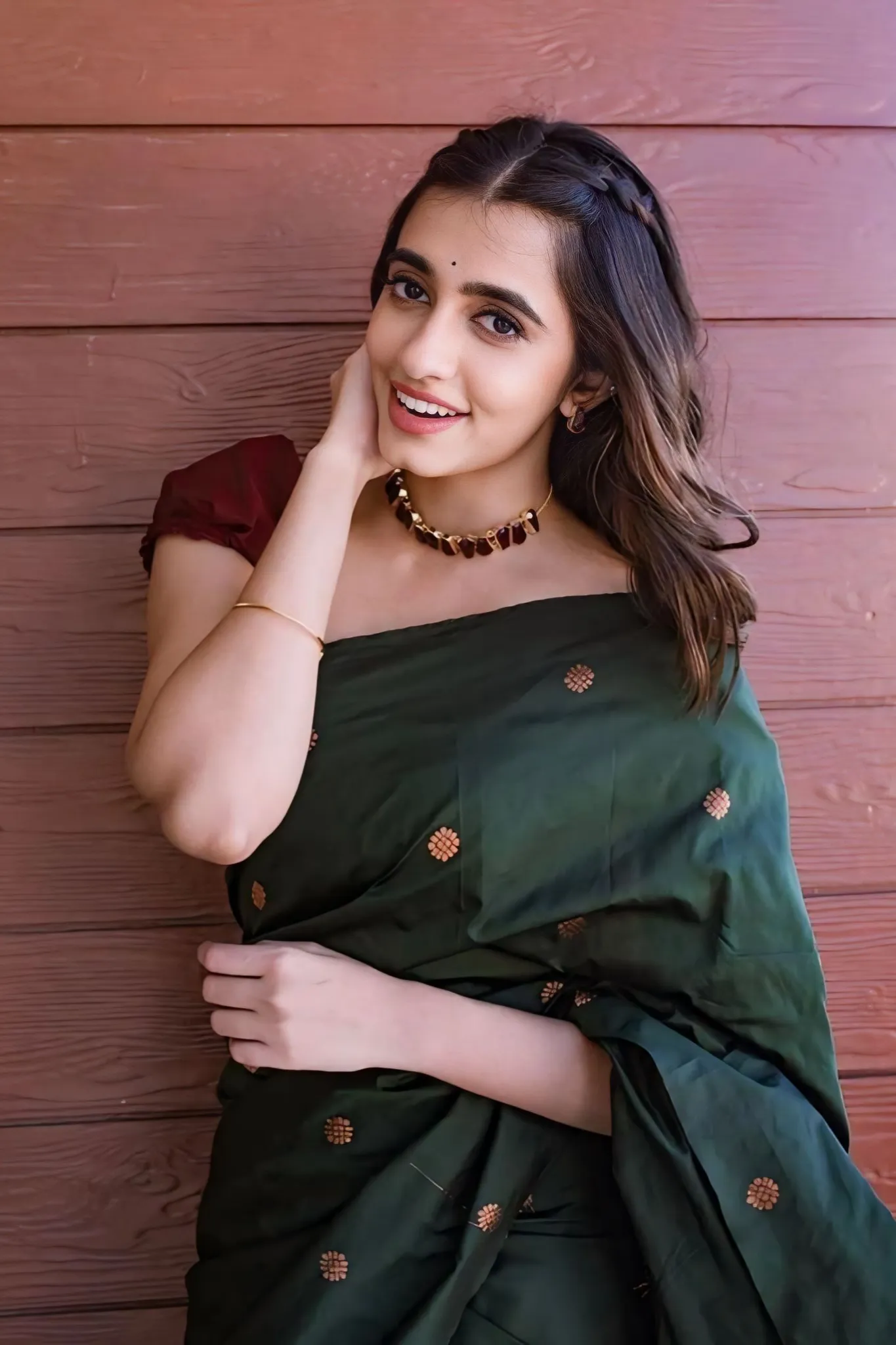 A FOREST SILK SAREE WITH SUBTLE ZARI BUTTAS AND RICH BORDER