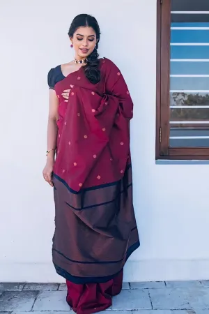 A FOREST SILK SAREE WITH SUBTLE ZARI BUTTAS AND RICH BORDER
