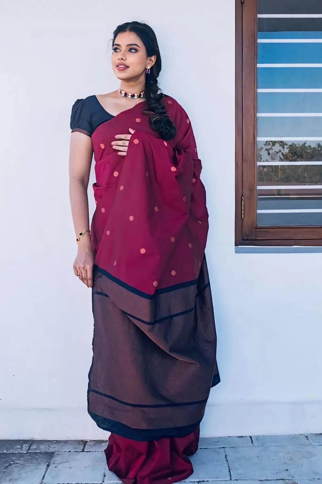 A FOREST SILK SAREE WITH SUBTLE ZARI BUTTAS AND RICH BORDER